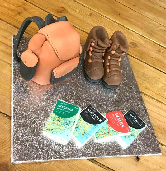 Walking boots, rucksack and selection of maps edible sugar cake topper